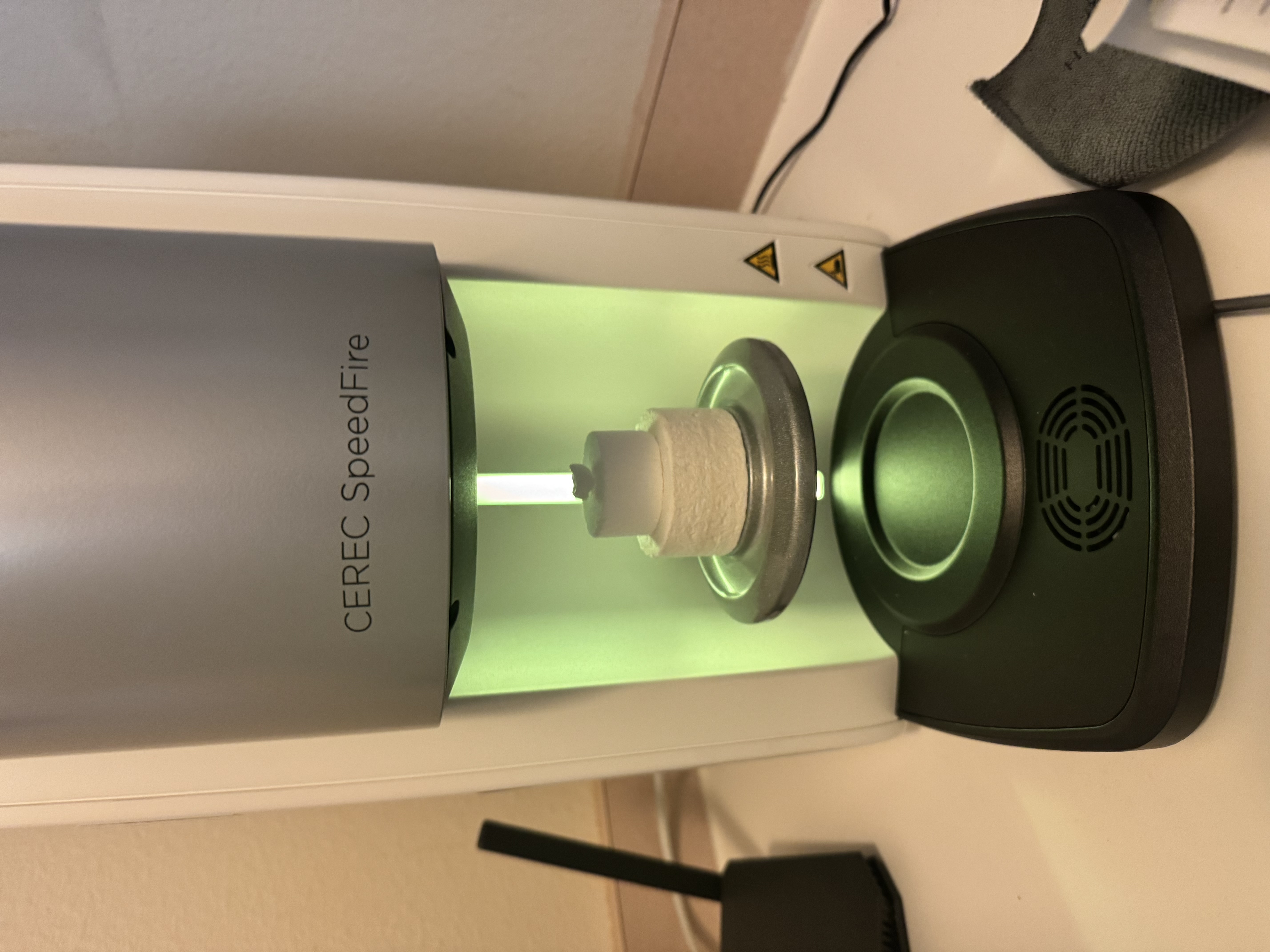 CEREC SpeedFire sintering furnace firing a zirconia crown at Korcek Dental