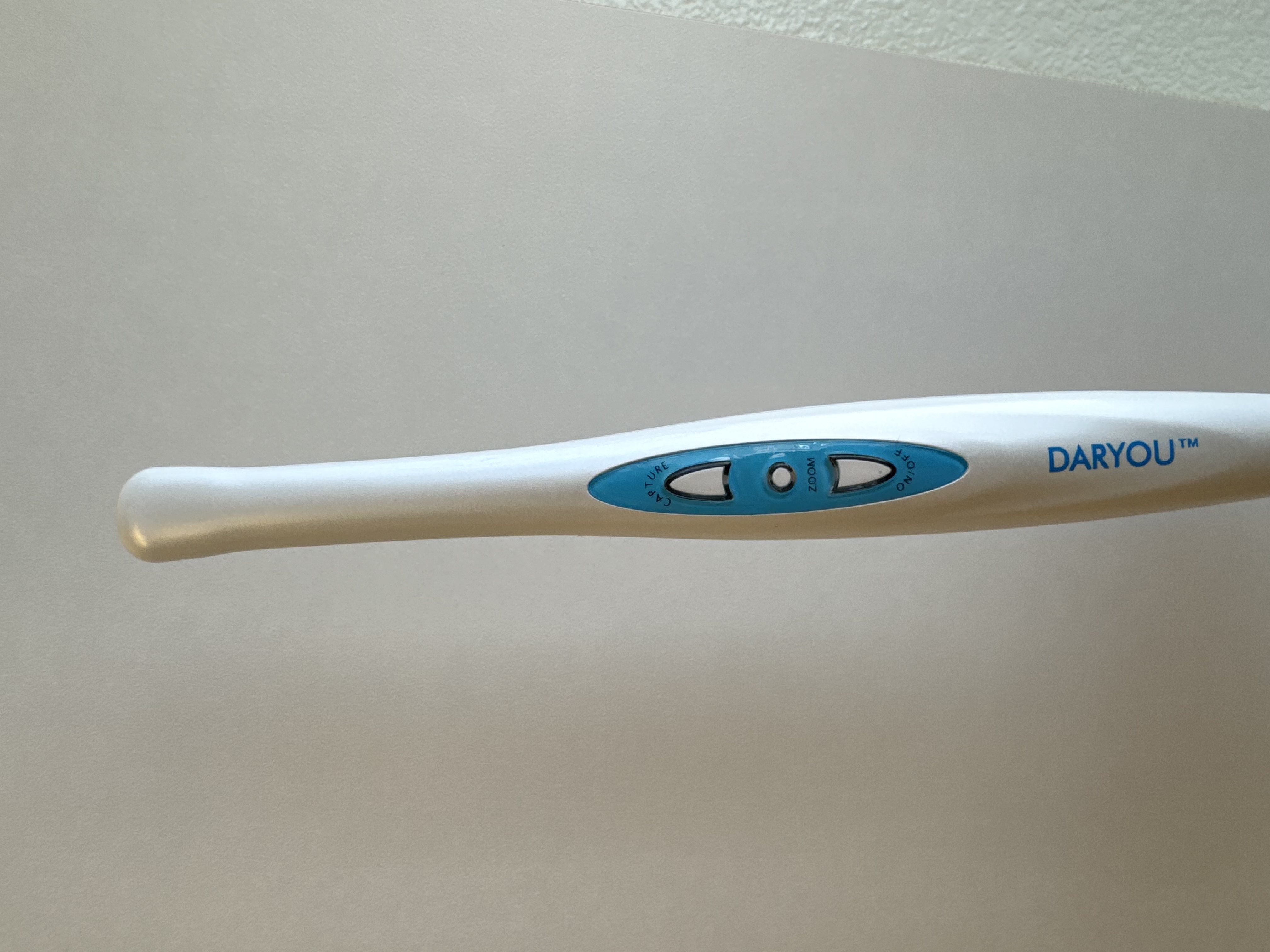 Handheld intraoral dental camera used at Korcek Dental for chairside imaging